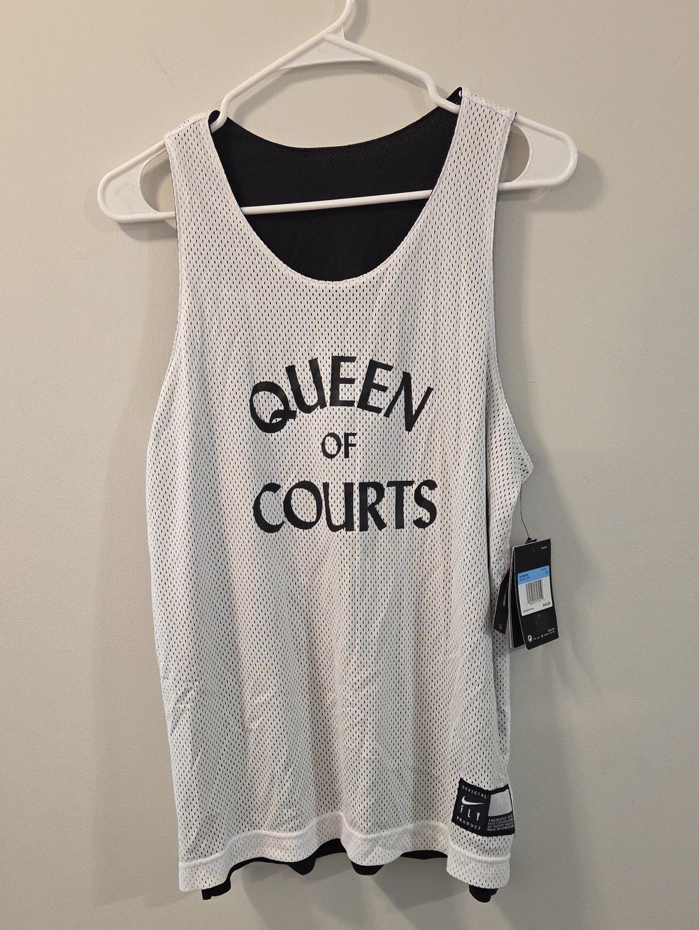 White and black Nike Women's Fly reversible basketball jersey